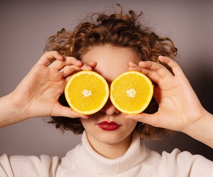 allure7 The Antioxidant Elixir - woman with oranges